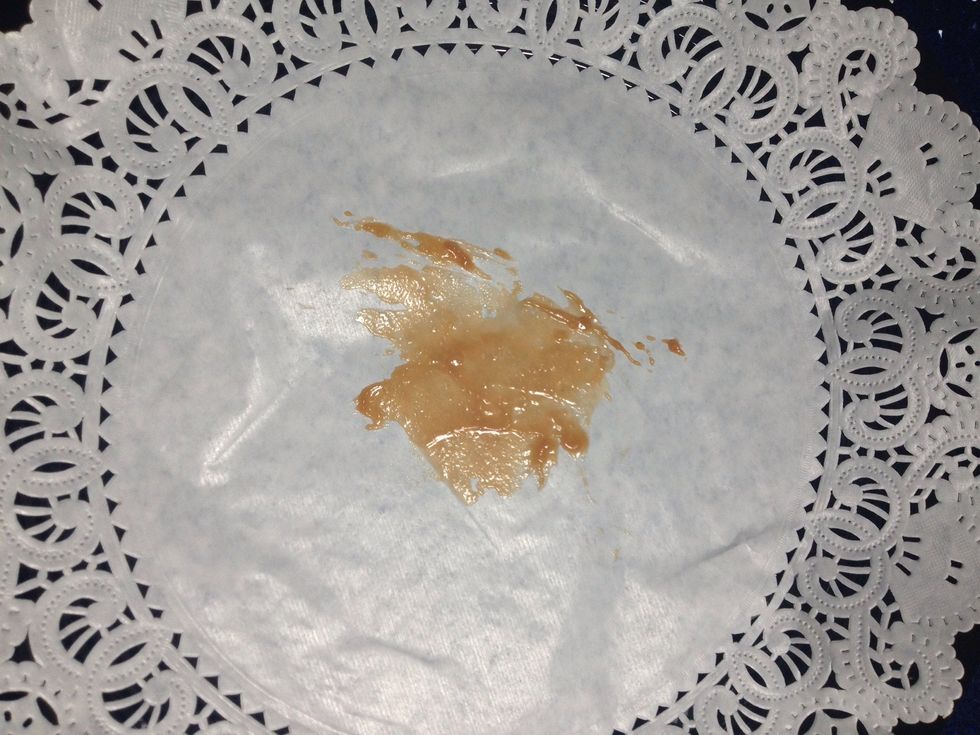 Smear just a little on the top of your doily, this will help keep the cheesecake in place.