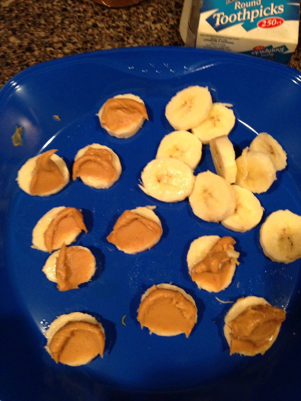 Smear PB on half of the banana slices. Don't be afraid to go heavy here. It's all good!