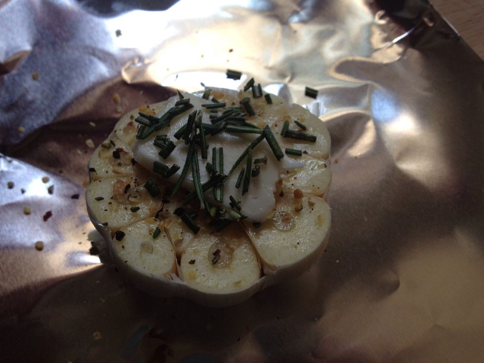 Smear some olive oil on top with your finger or a brush, put seasoning on after to stick. Top with a small square of butter. I topped it off with rosemary because that's how I roll.