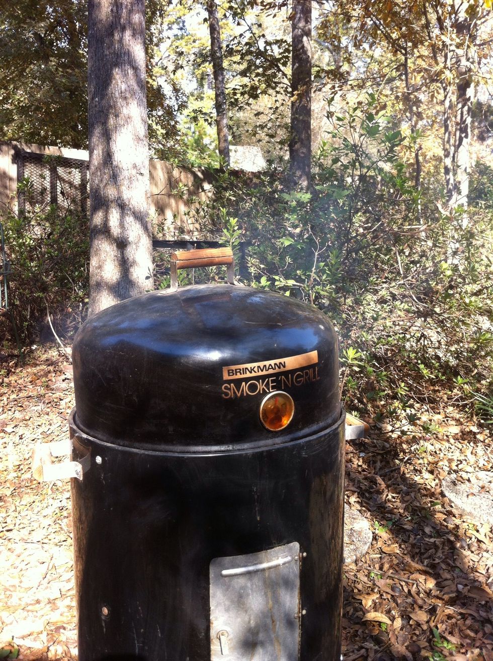 Smoke turkey over low heat until it is a rich dark brown color and an internal temp of 165 degrees is reached. The drumstick should wiggle loosely in its socket.