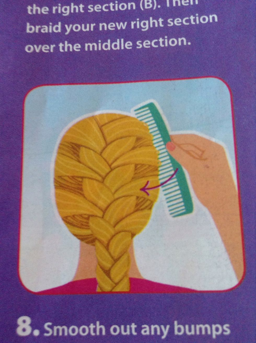 Smooth out any bumps on the sides of the head by gently combing toward the braid.