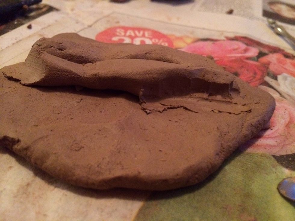 Smooth out the edges of the coils so that the clay blends into the original clay surface.