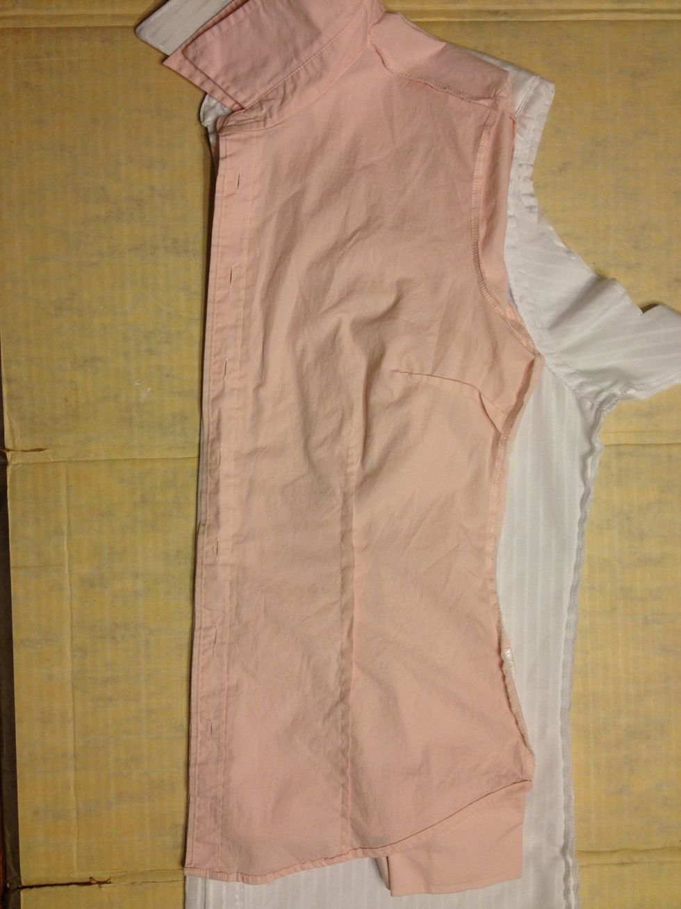 Smooth out the shirt and line it up along the buttons. Make sure that shoulders are lined up too!