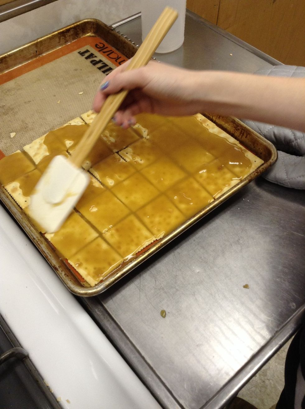 Smooth the caramel evenly across the crackers.