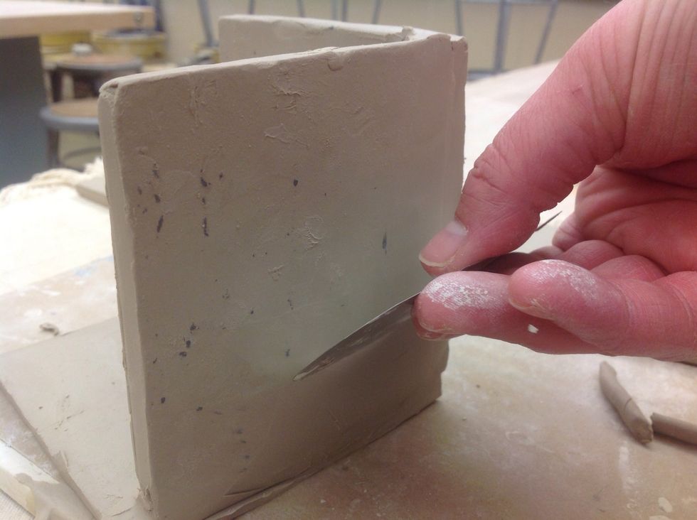 Smooth the outside of the attachment with a metal rib.