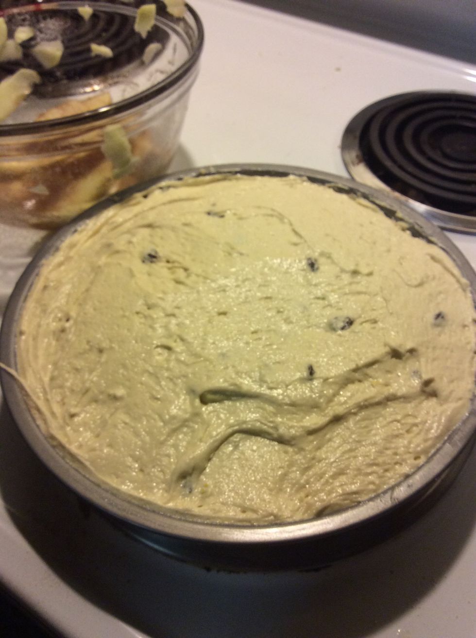 Smooth the remaining cake mixture over the raisins and hazelnuts