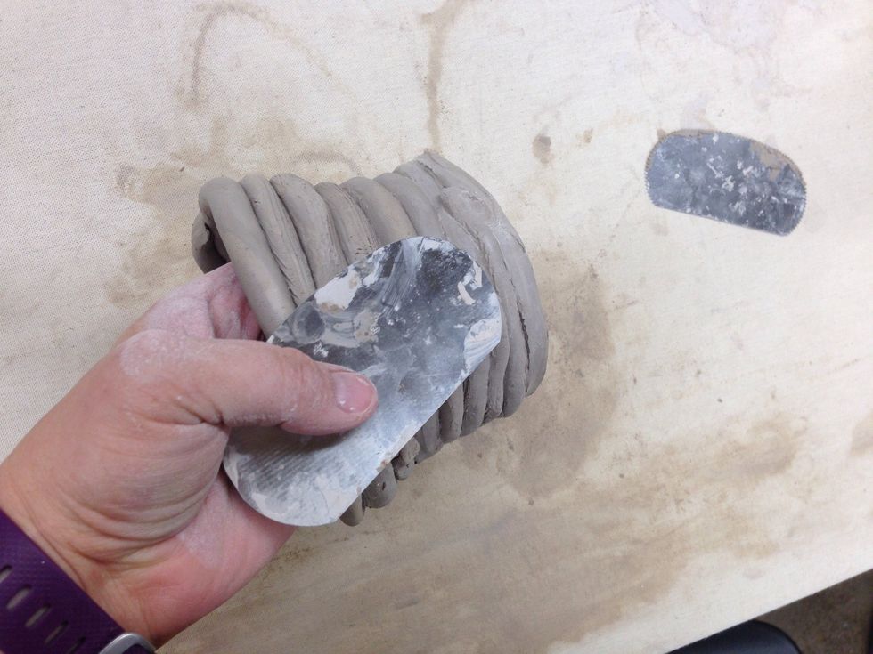Smoothing may be done with this kind of tool or your fingers to blend in the coils.