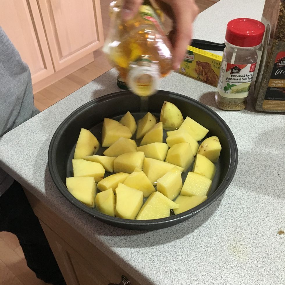 Smother the potatoes in the olive oil and water
