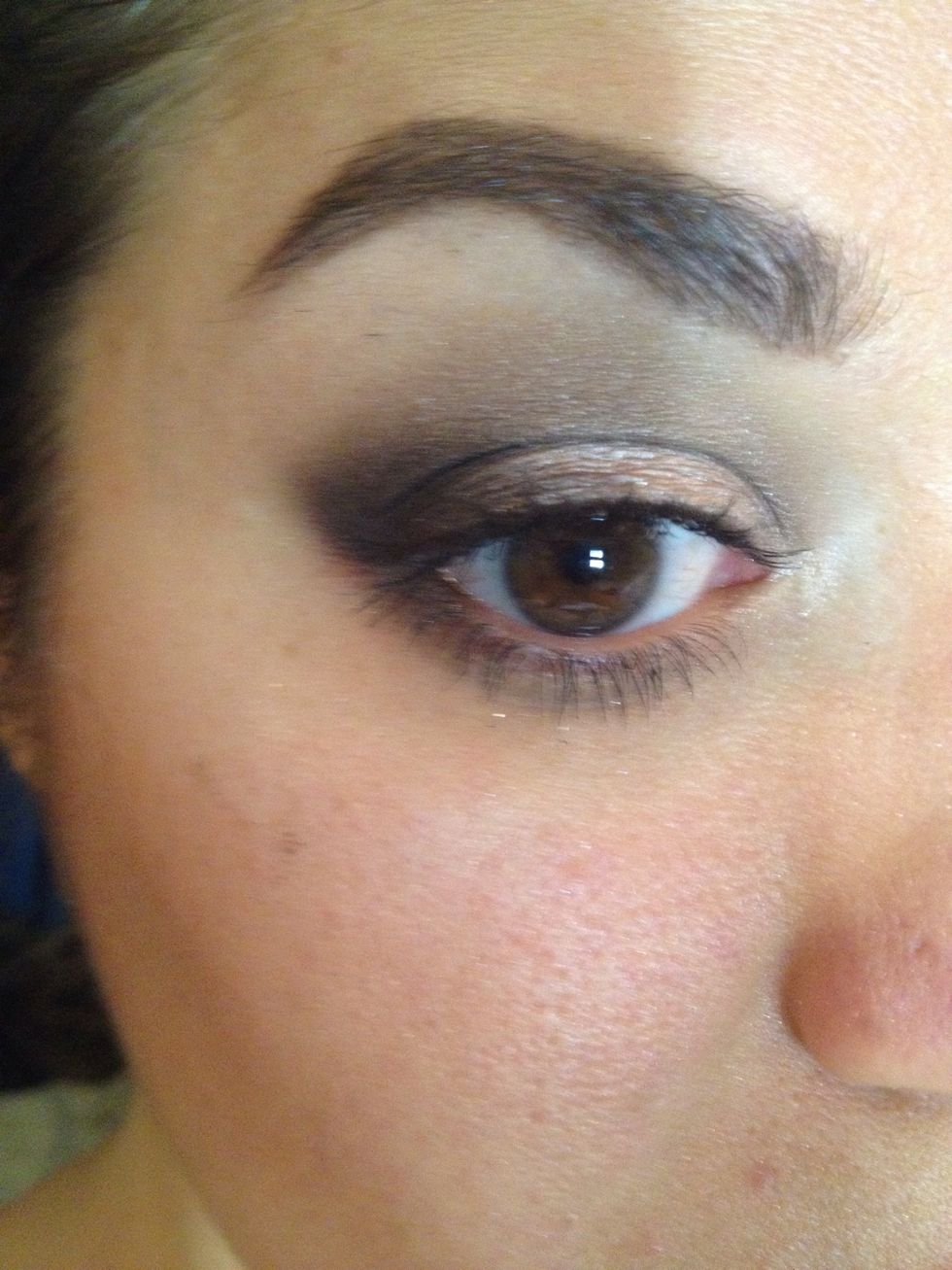 Smudge dark brown shade 1/4 the way across bottom lid