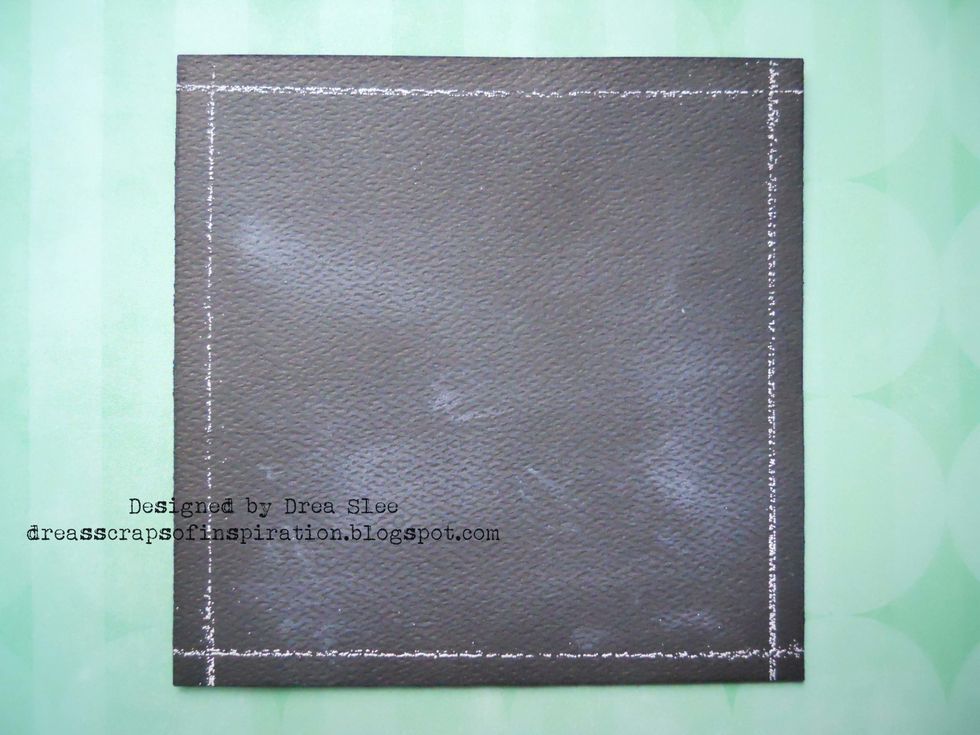 Smudge some white ink onto the cardstock to give it a "chalkboard" look. Then apply Black Soot Distress Ink around the edges.