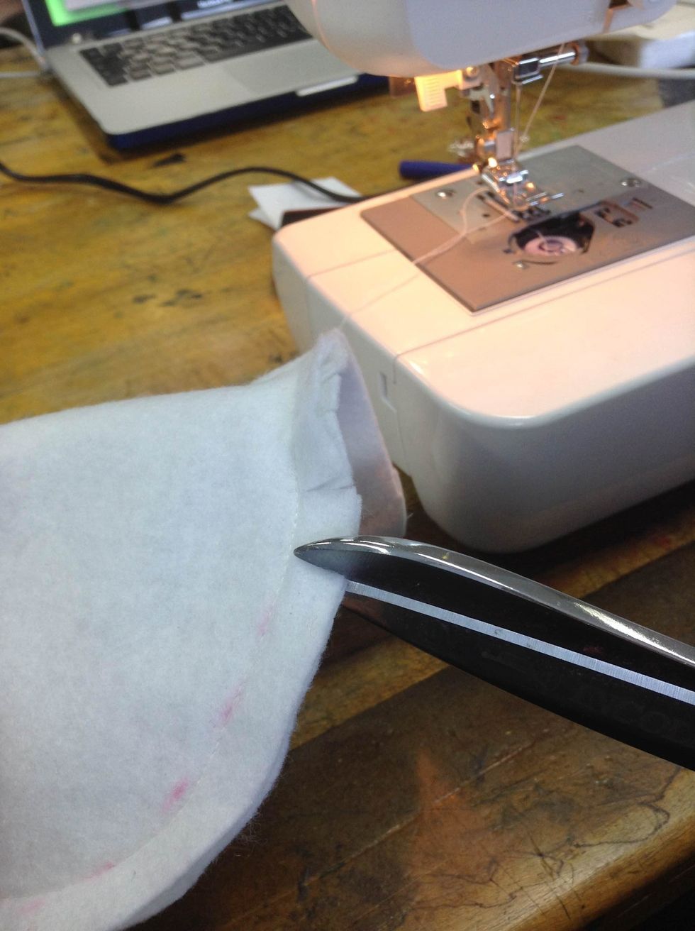 Snap the seam allowance all around the monster after stitching. This will help you to have sharp edges once you turn inside out your monster. Be careful and don't snap your stitches.