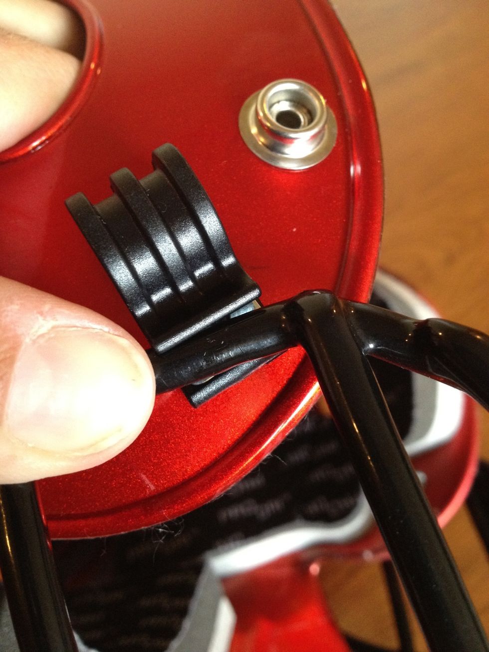 Snap the the middle space of the guard into the clip. Use your muscles because it's a bit tough to do! Snap sides in first then the top.