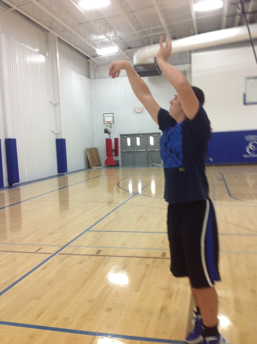 Snap your wrist and finish your shot.