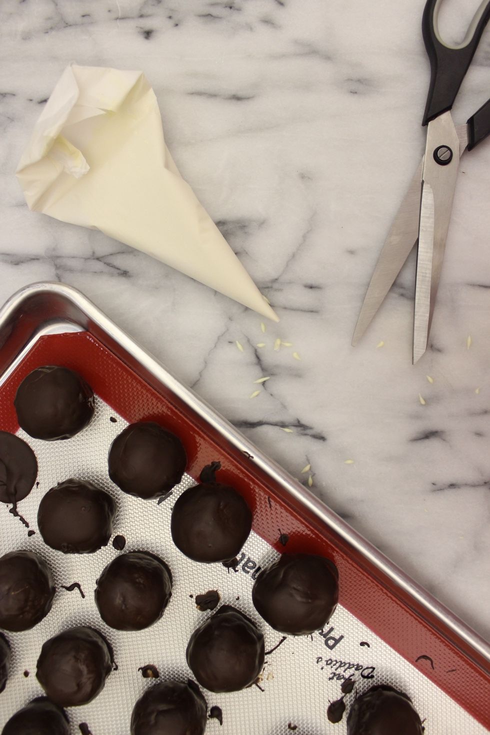 Snip off a tiny corner.