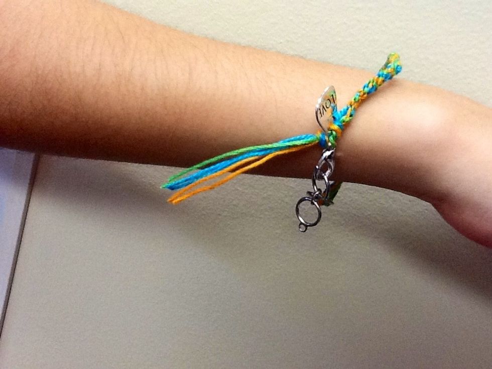 Snip off the excess thread at your desired length (leave them long, cut them, or braid them)