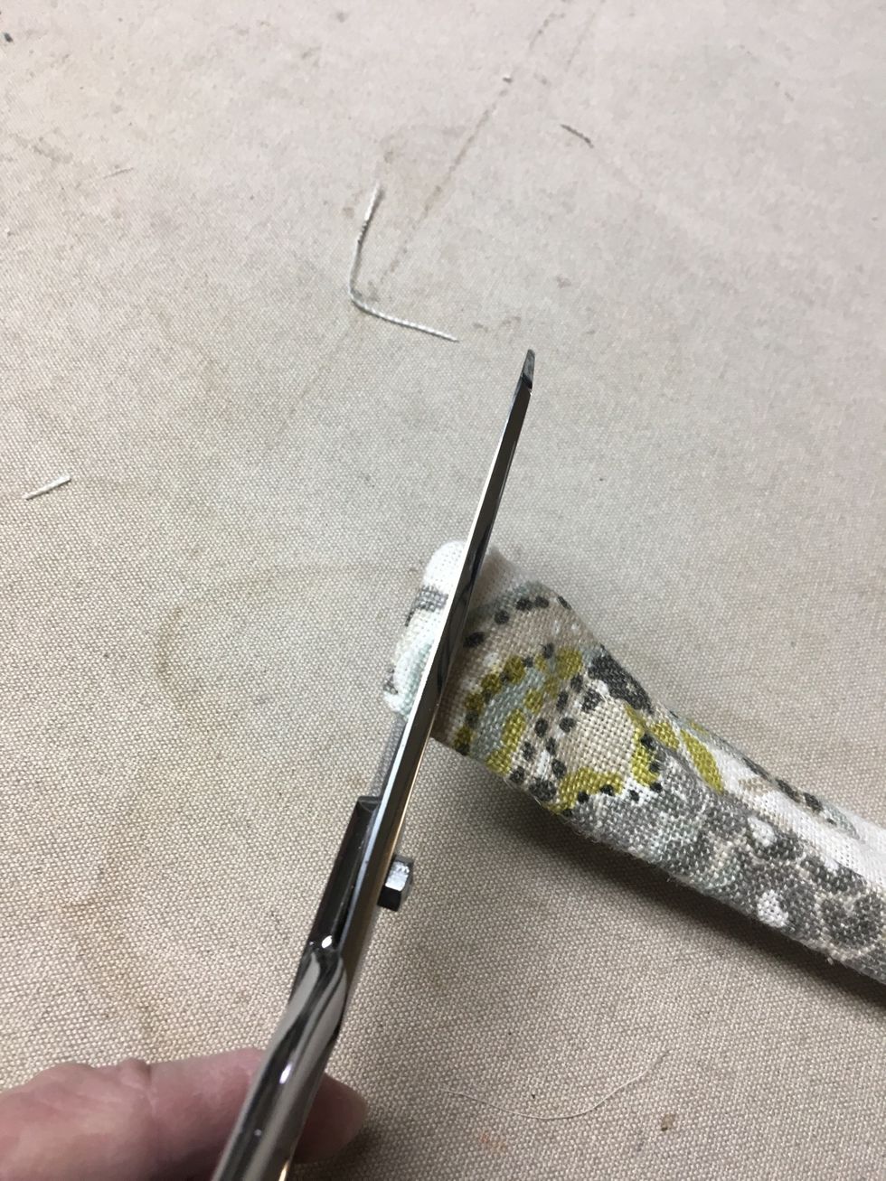 Snip the end off that you previously stitched closed.