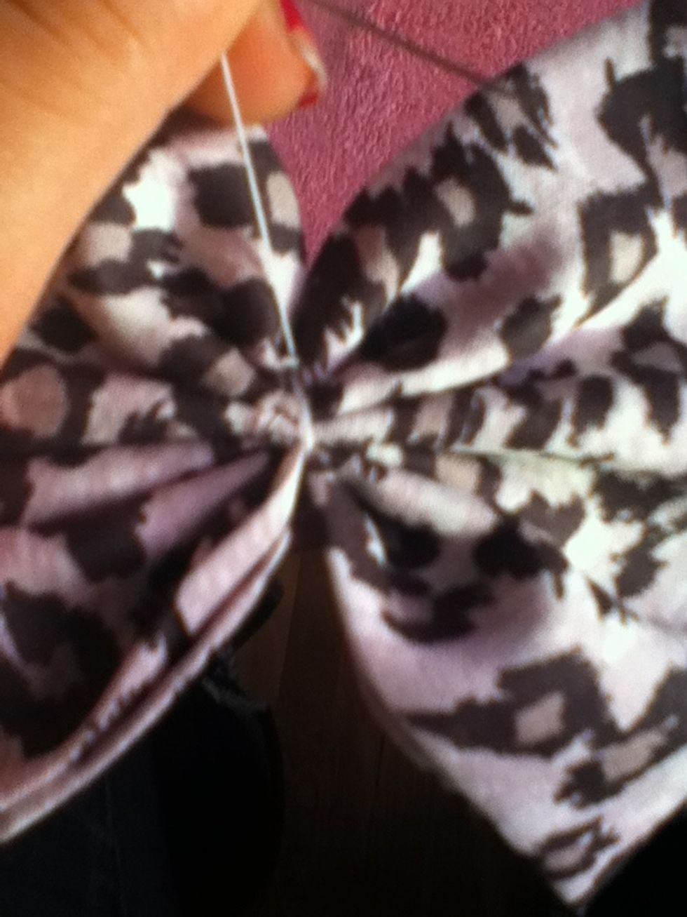 Snip the excess thread off.