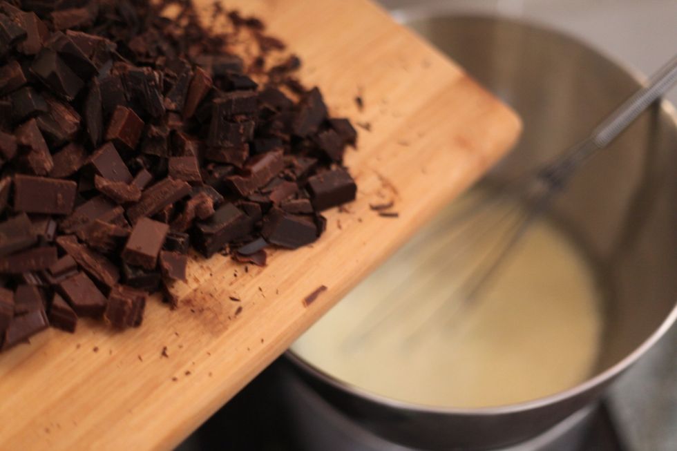 So a bit at a time, drop the chocolate into the cream and continuously whisk. Don't be scared if it bubbles a little. The gentle, yet continuous whisking (Don't stop) will make your ganache perfect.