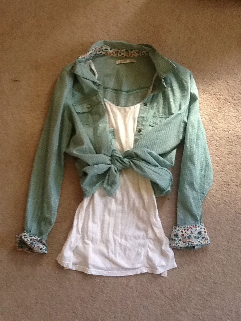 So first I took the ugly green shirt and put a cute white tank under it. Then I tied it up and look how cute that is!:) you can do this with any ugly western shirt or cut a long shirt down the middle.