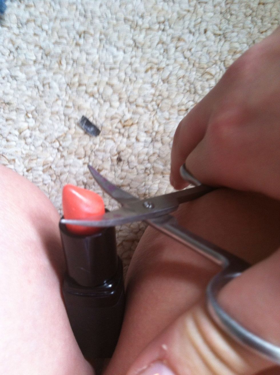 So first of all take your small scissors or whatever your using, to cut of a small slice from the top of your lipstick, the more you use the higher pigmented your lip balm will be