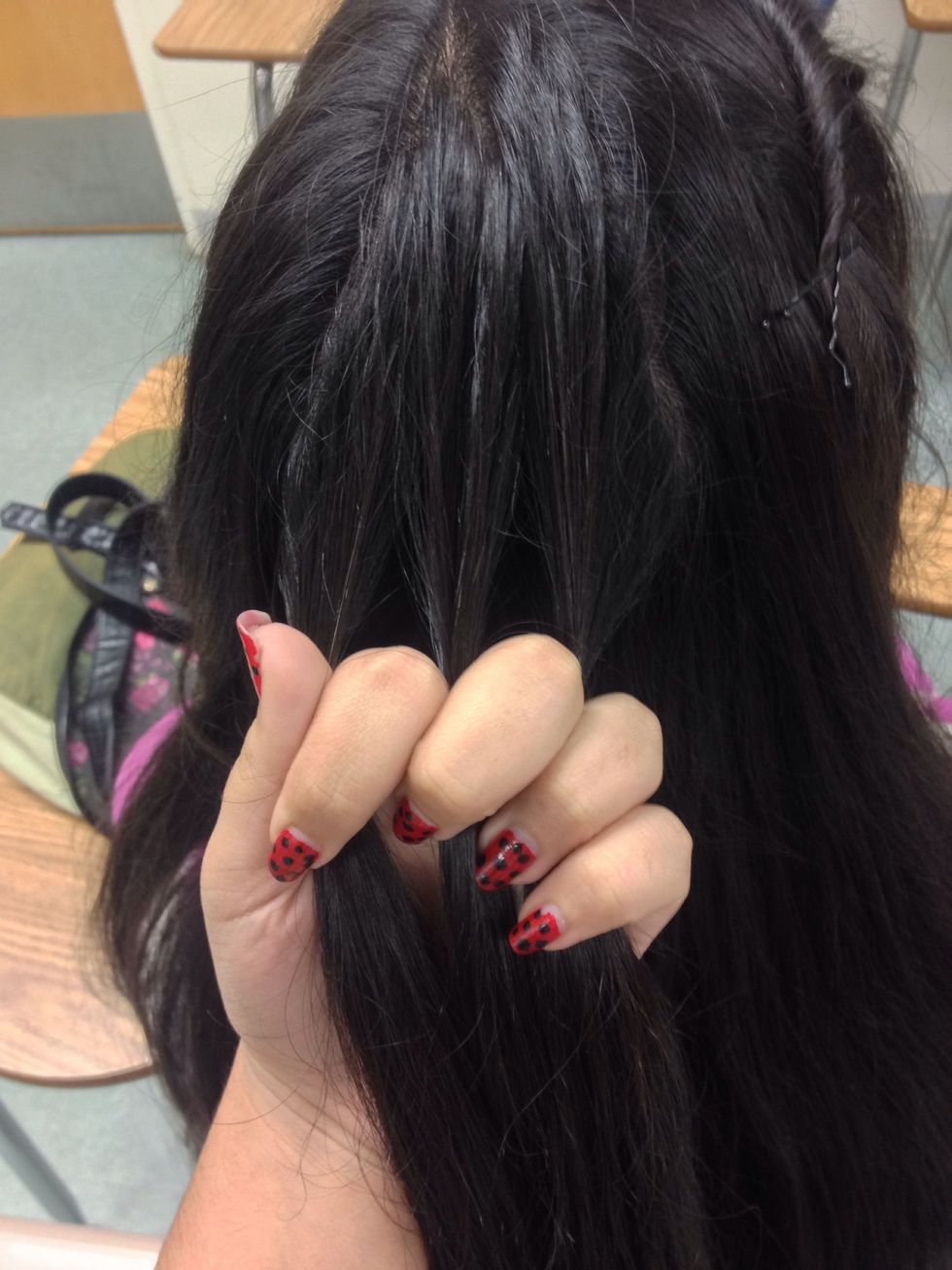 So first what you wanna do is start from a section not so far up on the head and divide it like a regular braid Just a reminder it's like a French braid but not so much to me