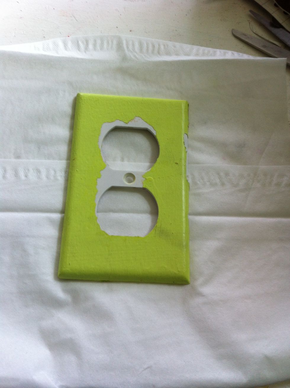 So here is my outlet cover (I peeled some of paint off)