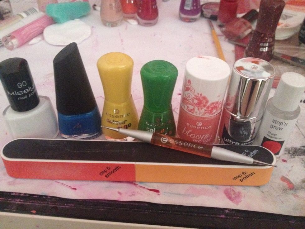 So here's the stuff I'm gonna use: nail hardener, white nail polish, different colors, dotting tool, etc.