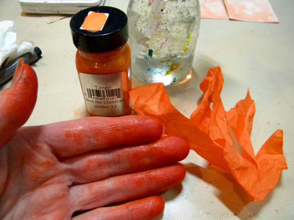 So I added Tango Velvet paint and water to the craft mat and wet the ribbon. Using my fingers, I smushed the ribbon around in the mixture. I dried it with a heat gun and it turned out perfect!