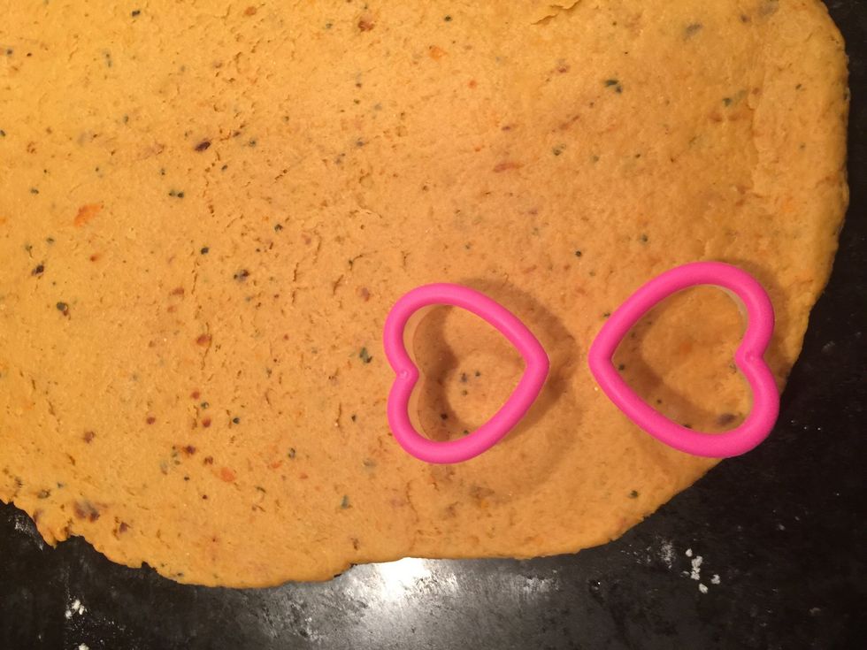 So I didn't have a dog bone shaped cookie-cutter so I improvised and used to little heart shaped cookie cutters. I left some space in between them for the middle of the dog bone shape.