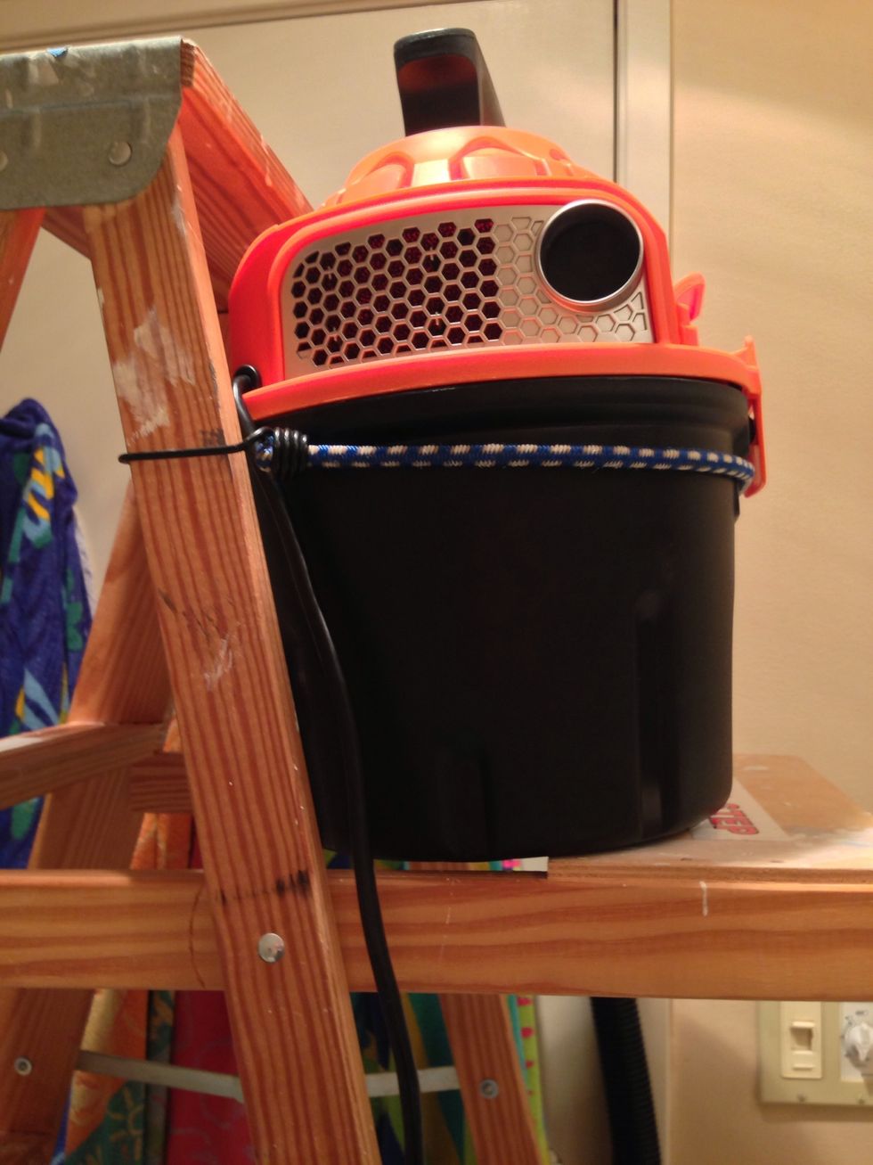 So I don't destroy my vacuum, I secured it with a bungee to the ladder.