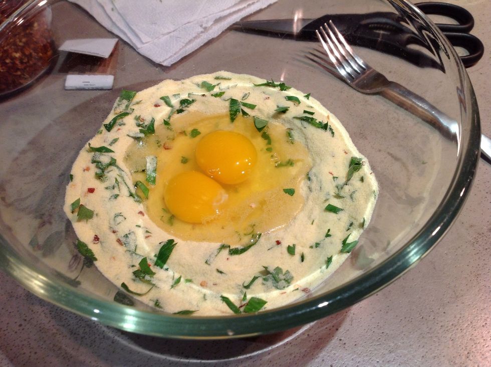 So I know that it's like 'real' to do the mixing on the table but I don't care. I do it in a bowl. Combine the chilies & chopped parsley with the durum, make a well, add the eggs and mix with a fork.