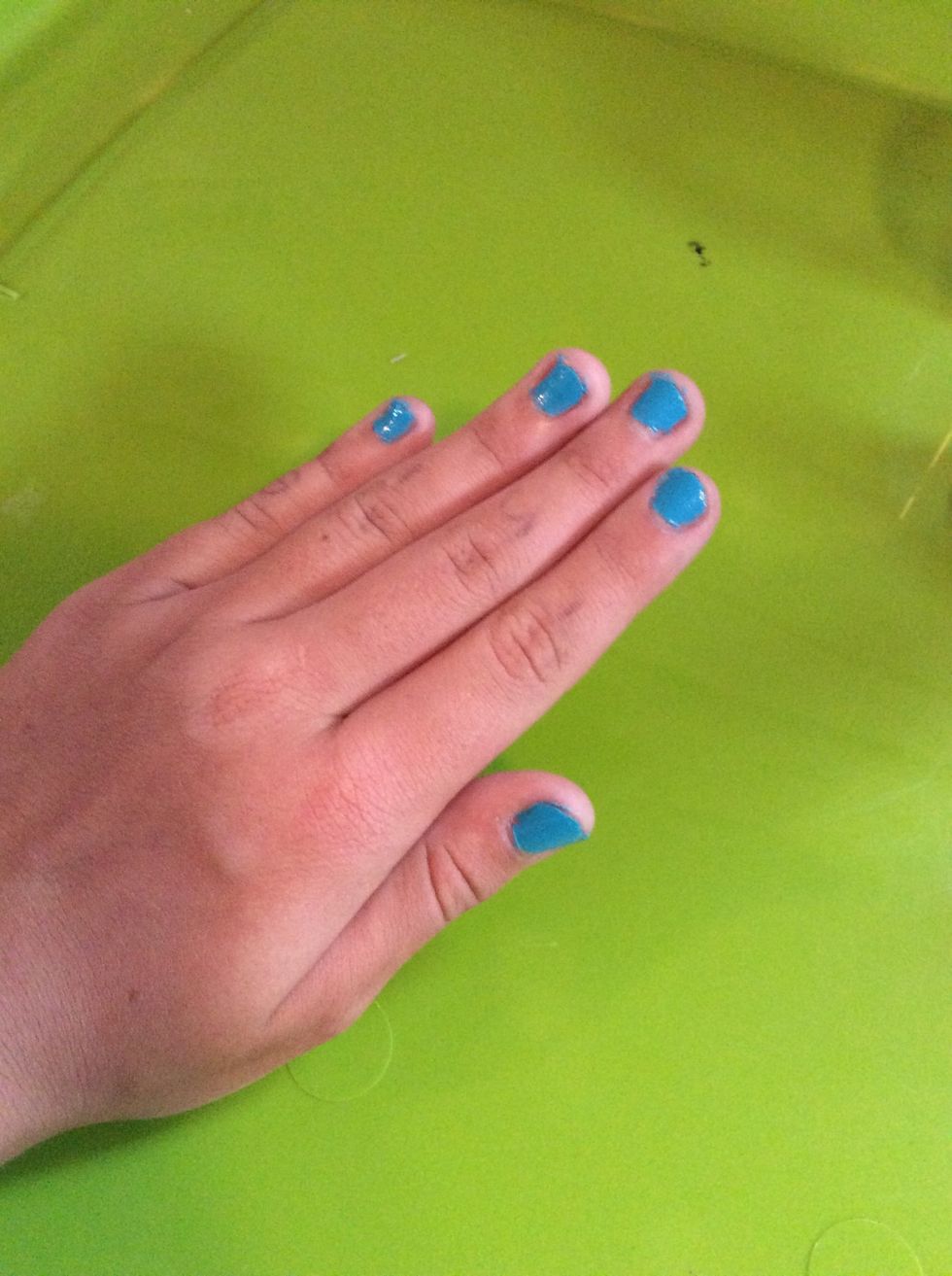 So I put on the blue polish and it's a bit messy but I will touch that up later