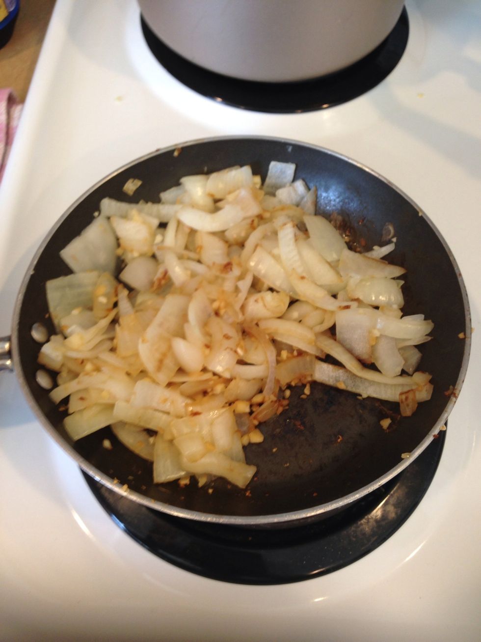 So lets start! Take the bulb of garlic and mince 1/2 or whole bulb. Brown it. Add the whole onion (cut how you like) Cook til onions are a little soft, (5 min). Set aside.