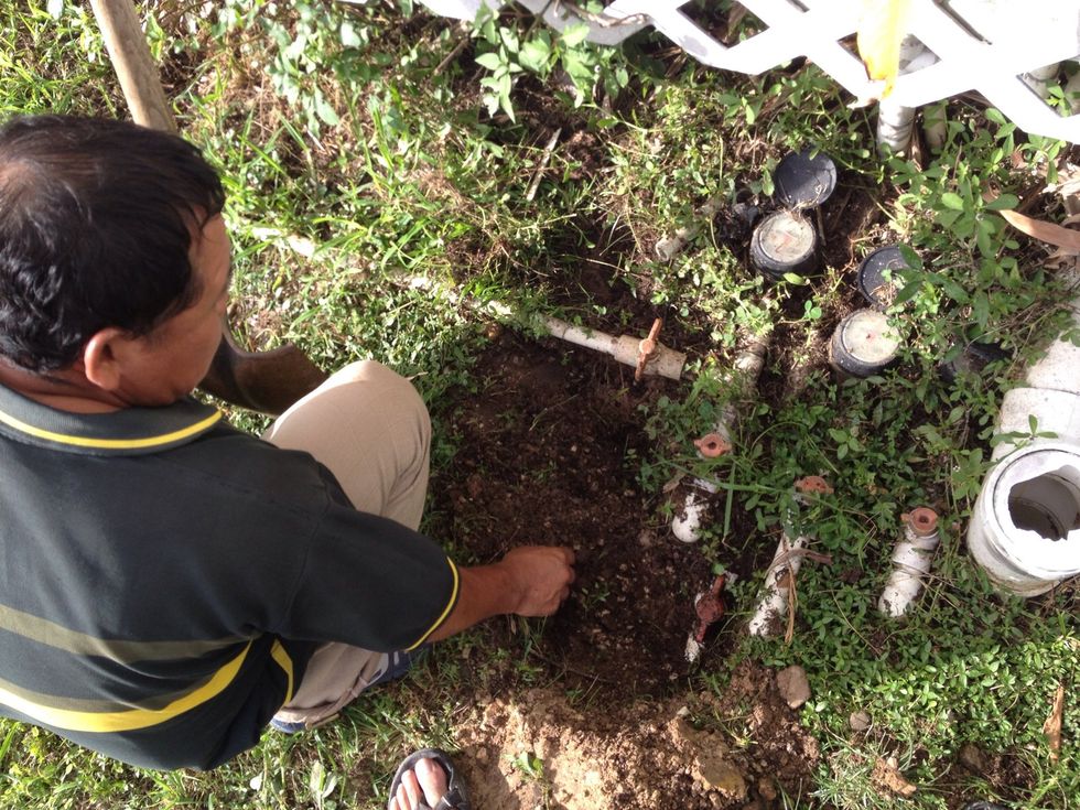 So Mr. Chun found some new pipes burried under the old ones and we proceeded to turn them off.