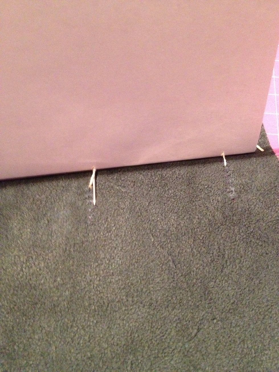 So now that you went from the top to the centre on the inside from the centre hole stitch thru again the centre hole out going thru the bottom hole to the inside.