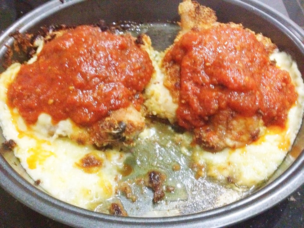 So place half a cup of tomato sauce on each chicken. Also, I drained out the excess fat in the pan! Don't want too much of that...