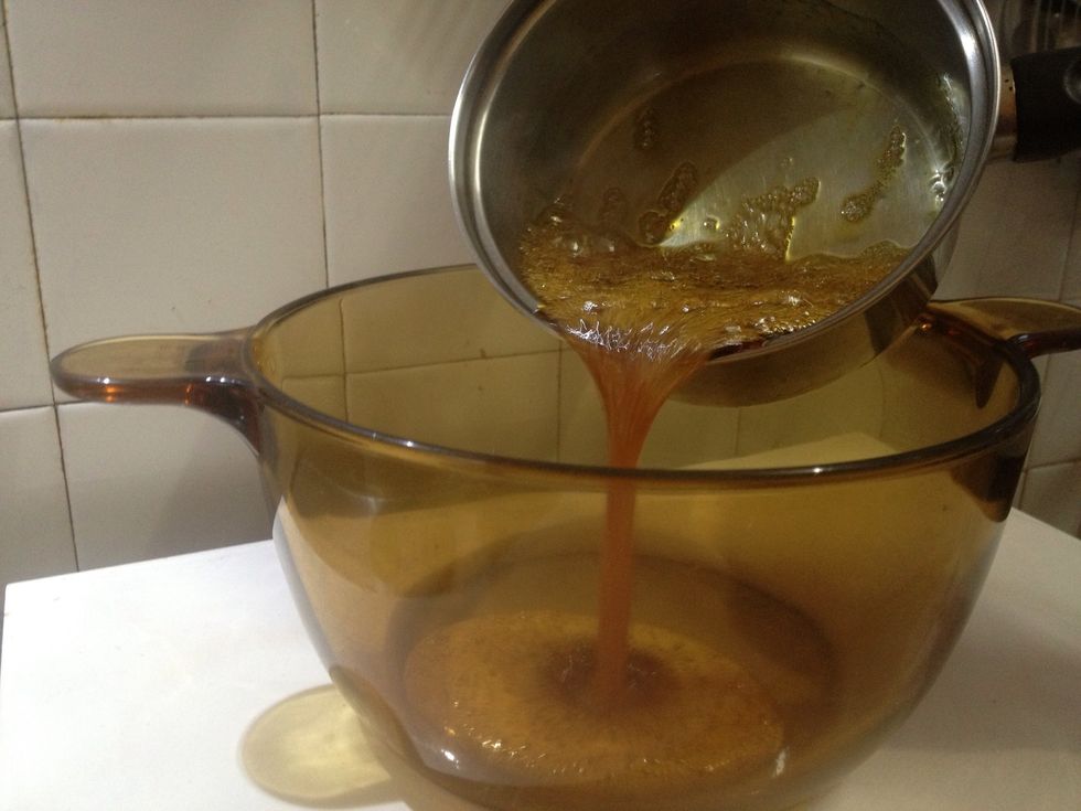 So quickly pour into a medium-sized oven-proof container that you'll need for your final step later on. (Don't throw the caramel residue. Add cocoa, milk and boil - you'll get instant hot cocoa \ud83d\ude09).
