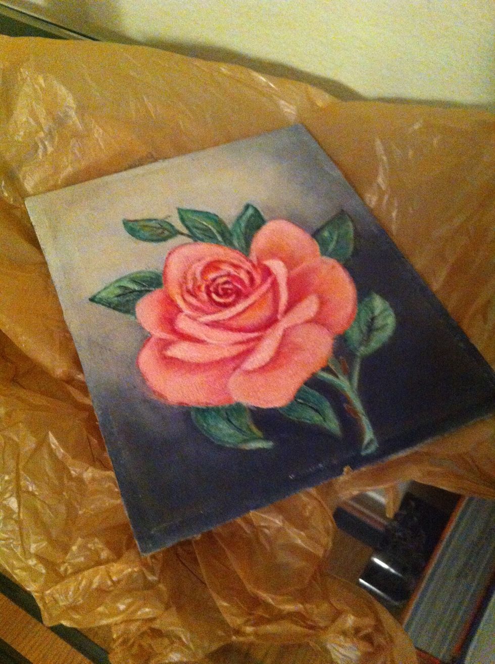 So remember that piece of glass and picture that was in your frame? Take the glass (my frame didn't have any so I'm just using the actual picture\ud83d\udc46) and spray a thin coat of the spray paint on it.
