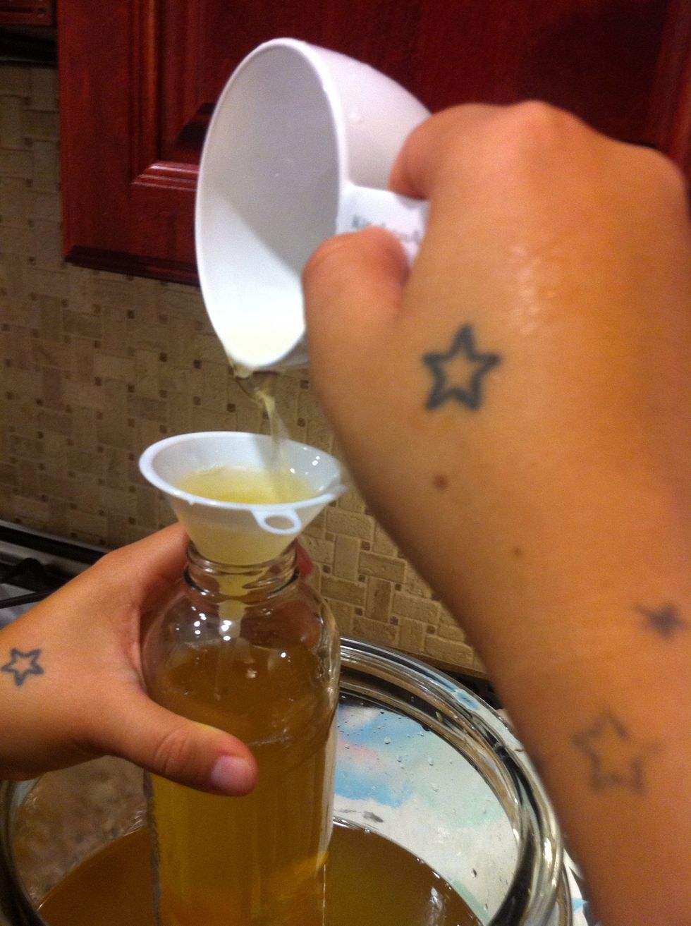 So the bottling begins!! I used a small funnel and a measuring cup. It was kinda messy but still fun. Once done I took them back to their dark spot to be for 3 more days.