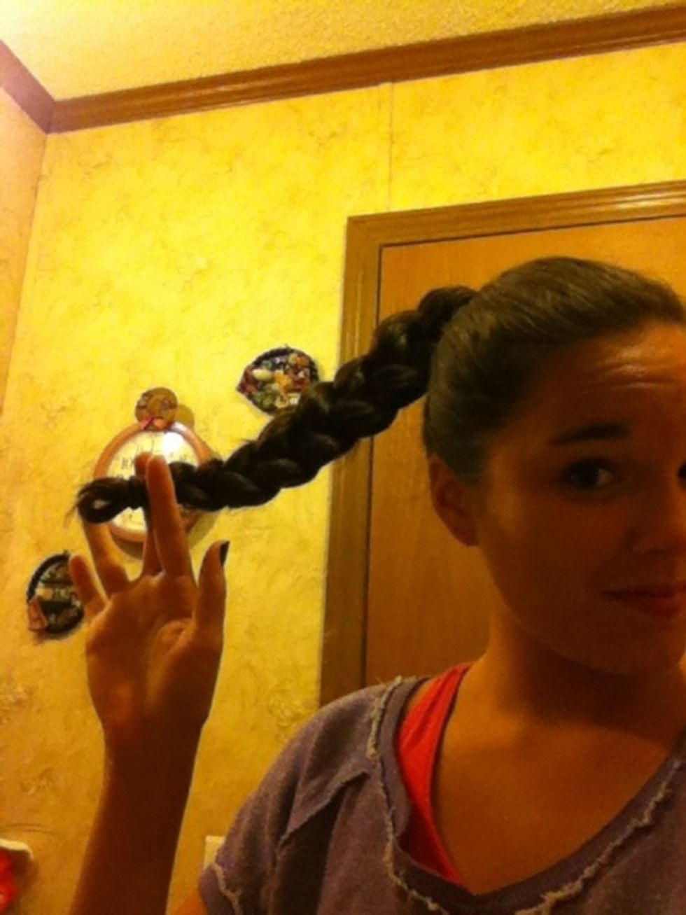 So the next step is to braid you pony. You can do a three strand or a fishtail it's whatever you like. I suggest making a loop at the end so you don't have to worry about trying to tuck it all in.