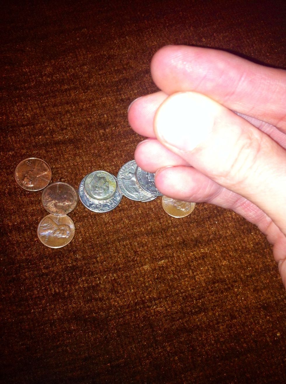 So they think you just picked one of the coins up. But your hand is actually empty. Hold your phone in your other hand and pretend to throw the coin at the screen. At the same time shake the phone.