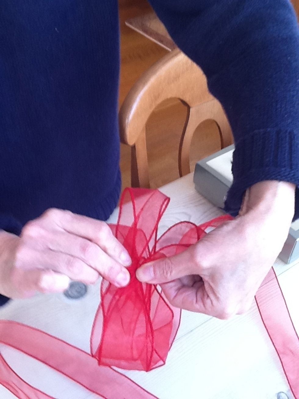 So this 6 or 7 more times twisting the ribbon over as tight as you can each time you complete a loop