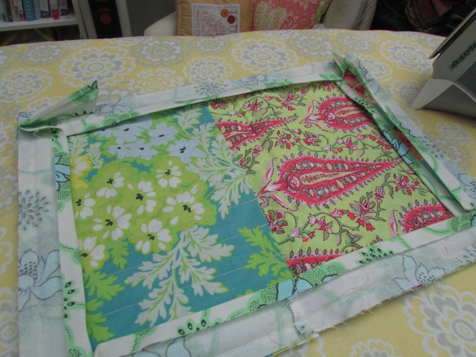 So this is a view of the almost finished case: needle pocket on left, and tiny pocket on the right to secure the needle tops. Now to press the edge trim away from the inside.