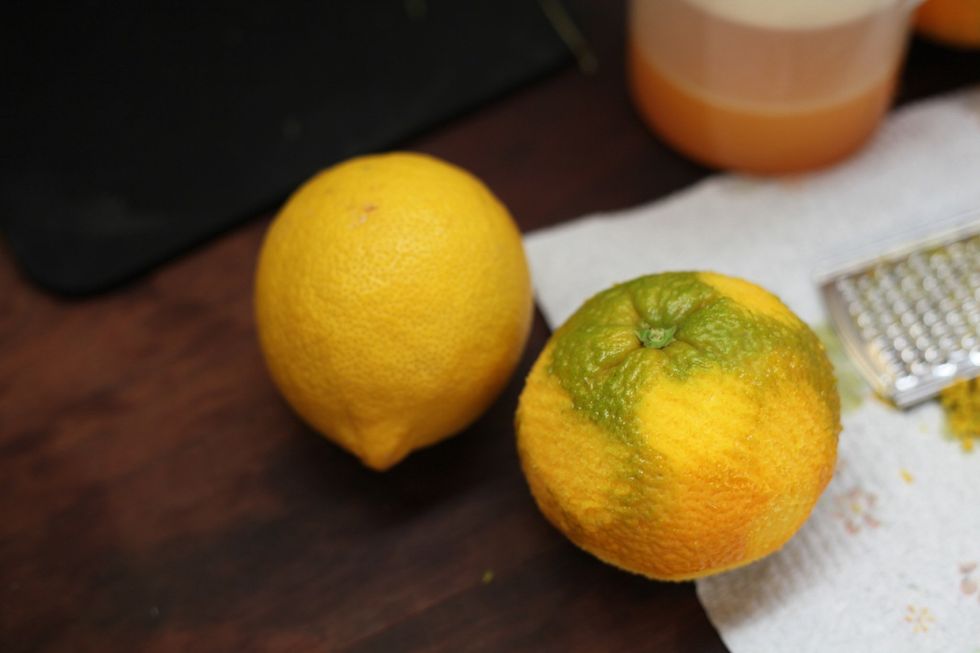 So we are going to grate the lemon and orange rind to make about 2-3 tablespoons of lemon rind. Don't throw away anything we are going to juice them in the next step.