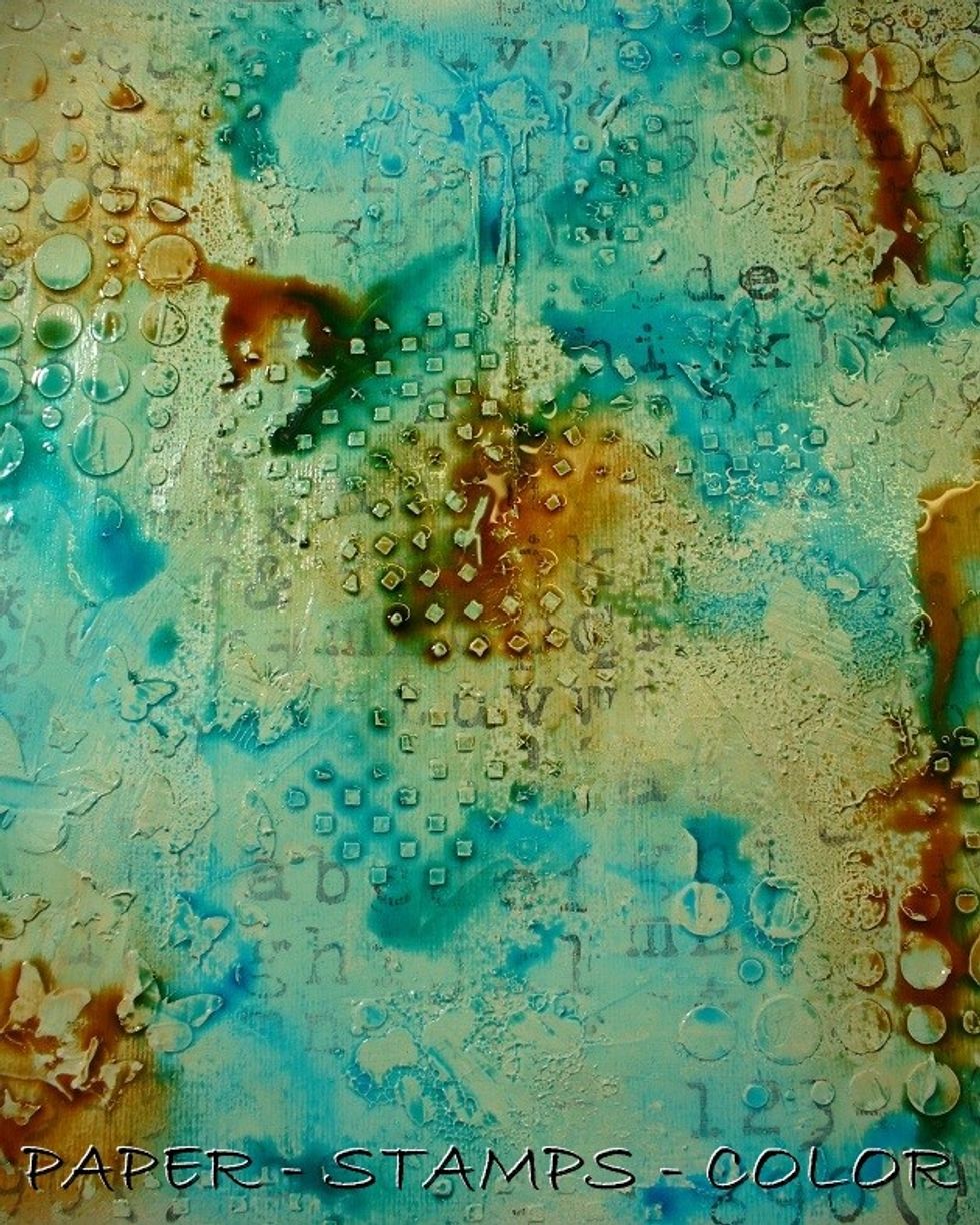 So, while the gesso is still aprtially wet, mist away with Colorations Spray. See the supply list for the colors I've used.
