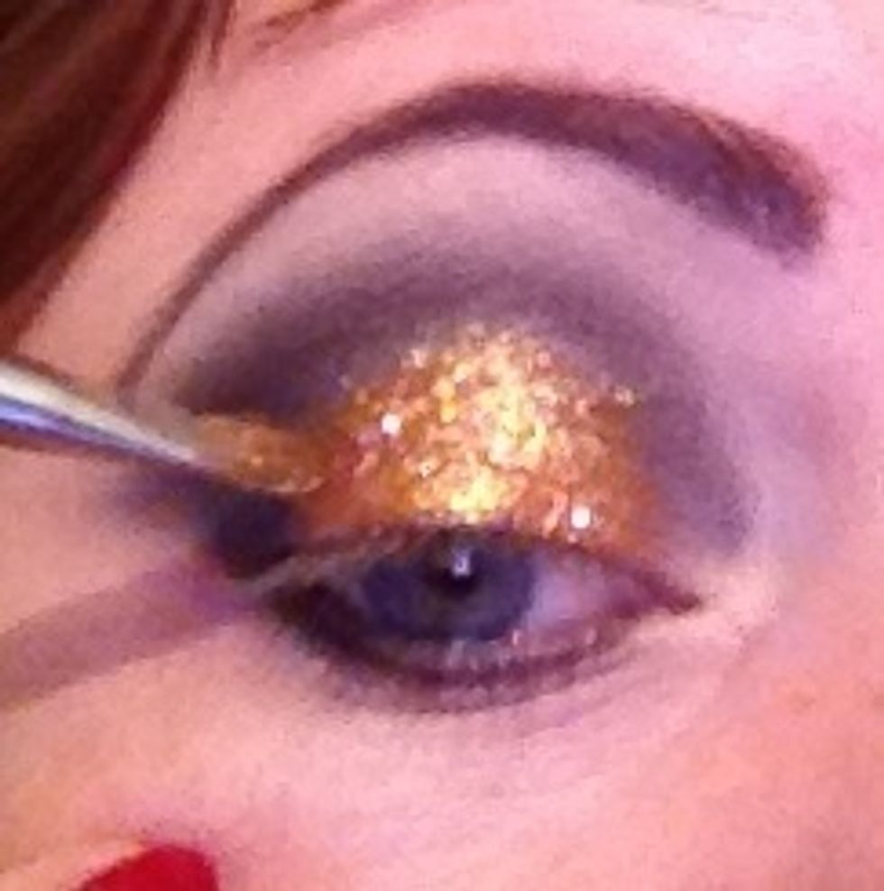 So you can see here I've built more colour and glitter into the eye and gradually building.  The glitter used is a fine glitter I wanted a mix so I've added a browner course glitter close to the black