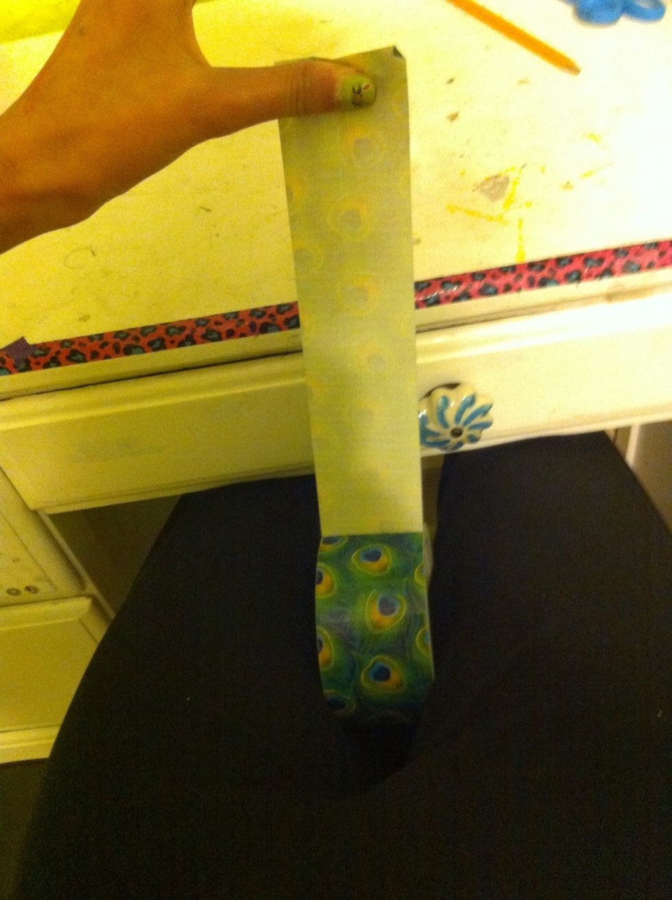 So, your gonna take a strip. (I'm holding the roll between my legs while I cut so it doesn't slip)