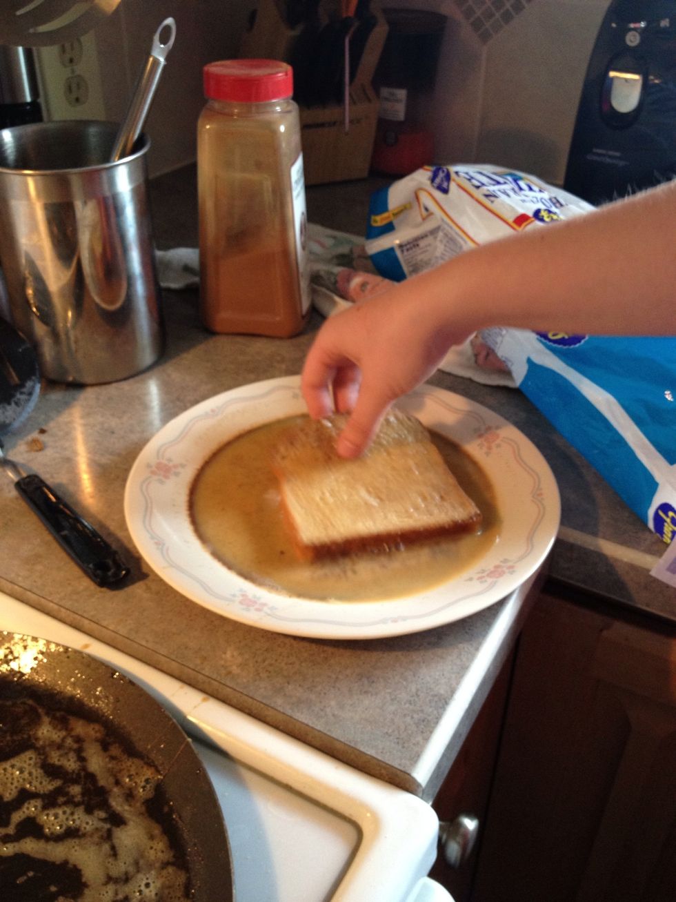 Soak bread in egg. Any kind of bread will work, we just used white bread this time, but Texas toast is AMAZING.