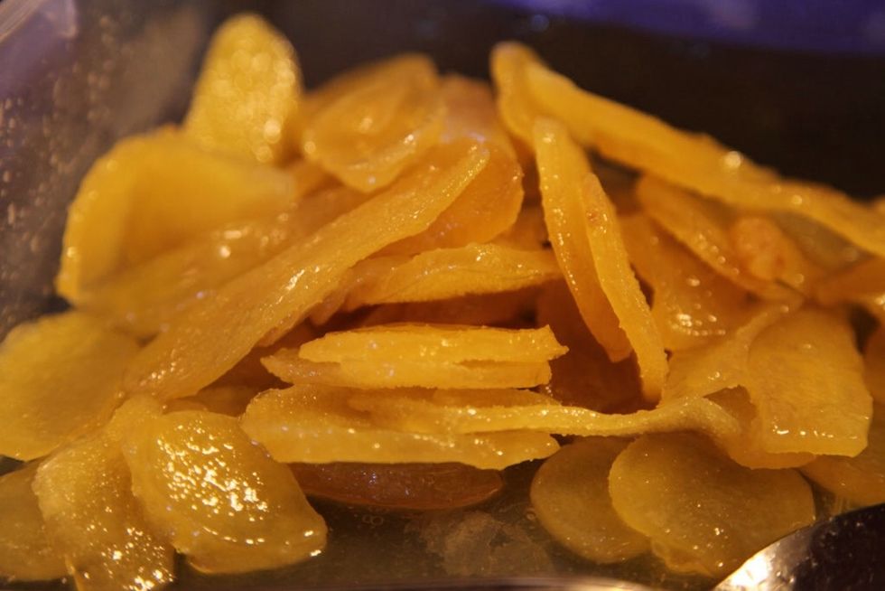 Soak candied ginger slices in Don Q Coco the night before for an extra rummy kick.