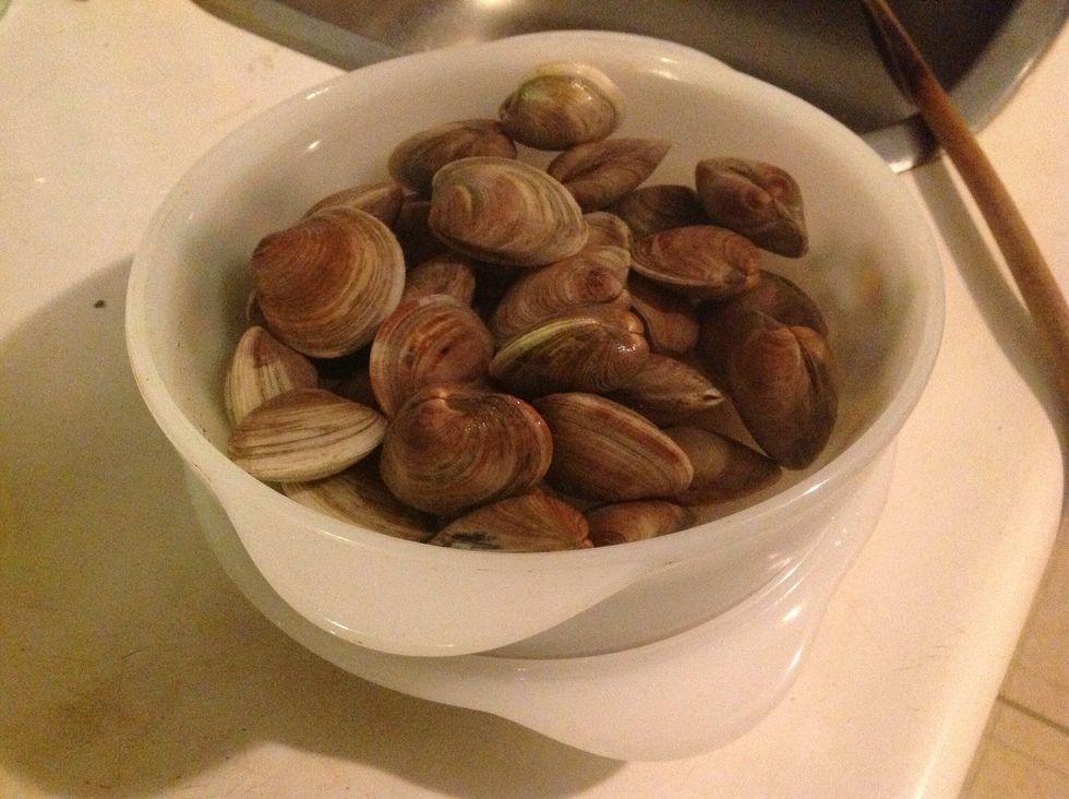 Soak clams in cold water for 30 minutes. Drain and rinse and then cover in cold water again until ready to use.